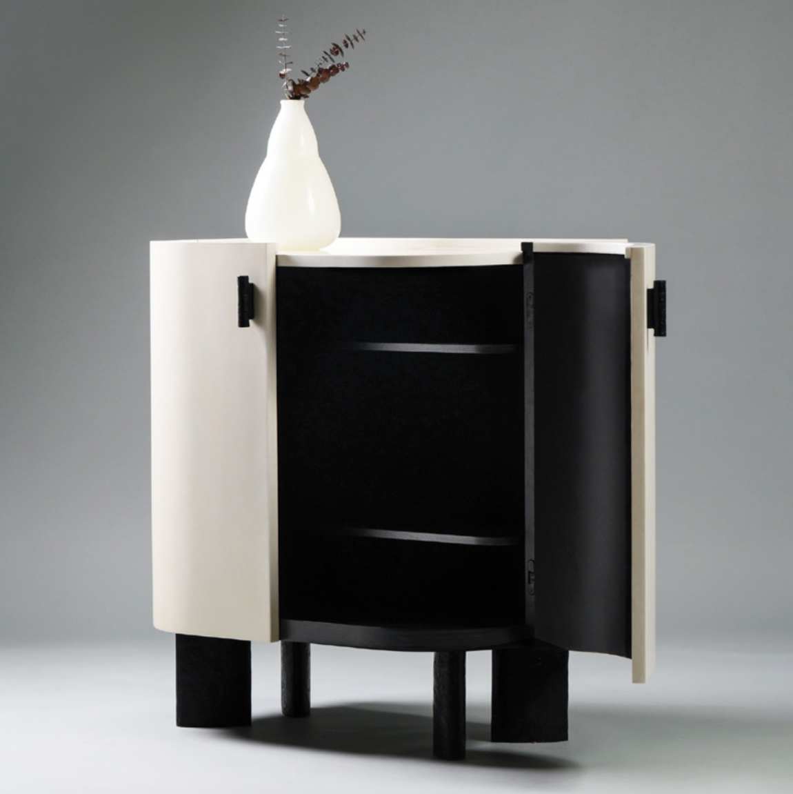 Modern cabinet with a white vase on a gray background