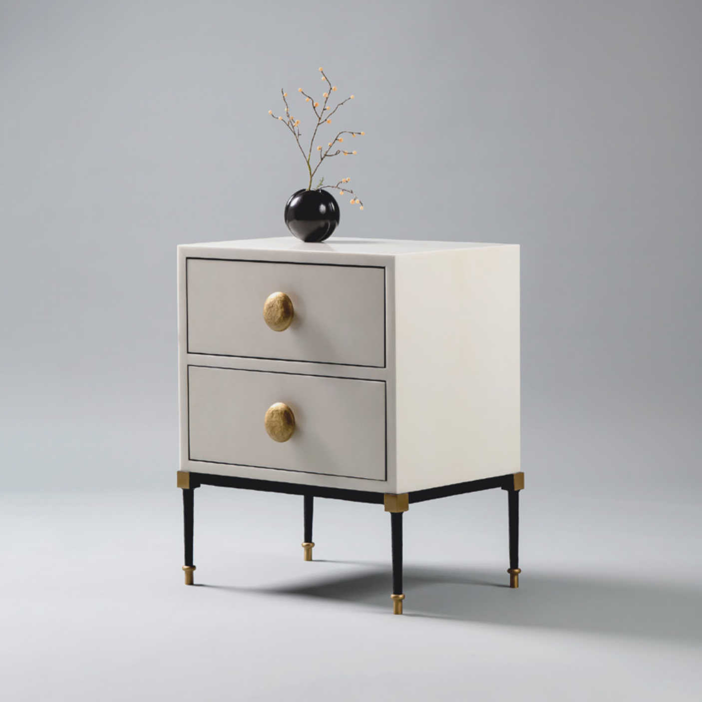 Luxury ivory nightstand with gold knobs on a gray background